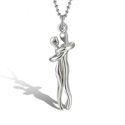 Silver Hug Me Tight necklace pendant shown from the side