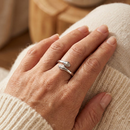 Model wearing the adjustable silver Hug from Heaven ring, close up
