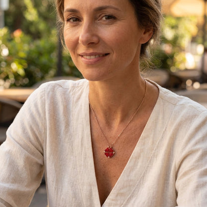 Model wearing the red magnetic heart necklace