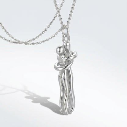 Silver Hug Me Tight necklace with a soft 3D shadow