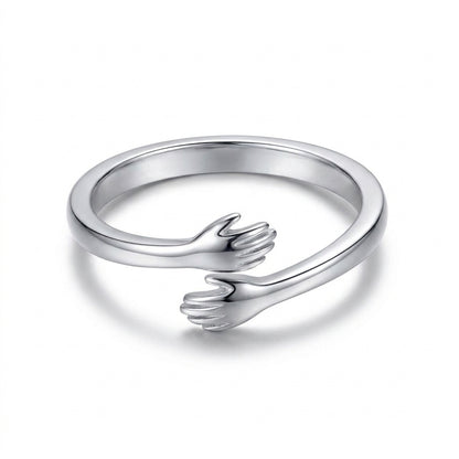 Silver Hug from Heaven ring on a white background
