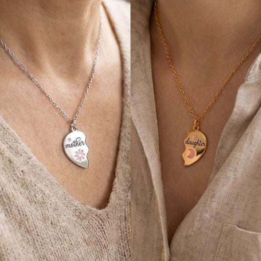 Mother and daughter matching half-heart necklaces worn by a mother and her daughter