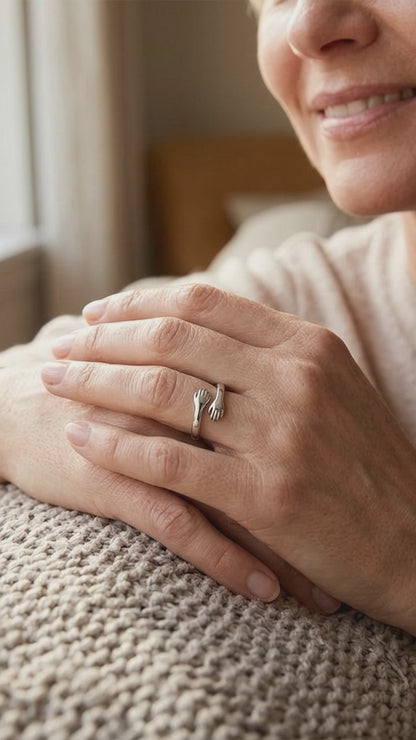 Short video of a hand wearing the Hug from Heaven Ring, a ring with two hands hugging